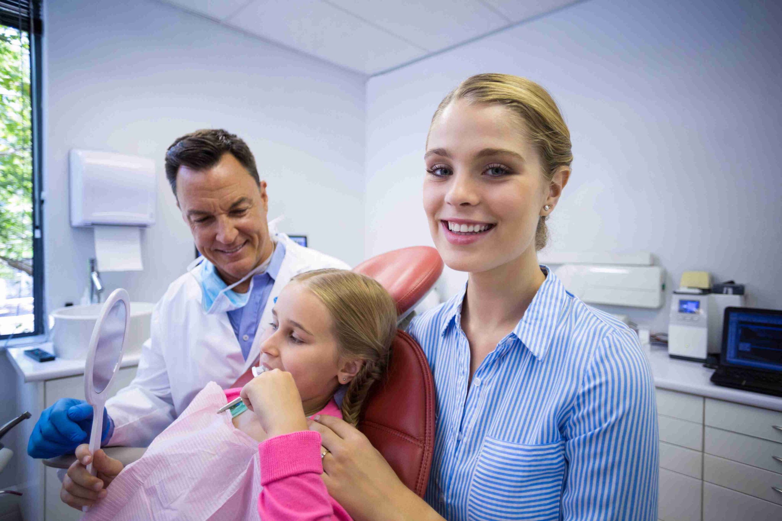 Dental visit with a mother and child during an oral health checkup.