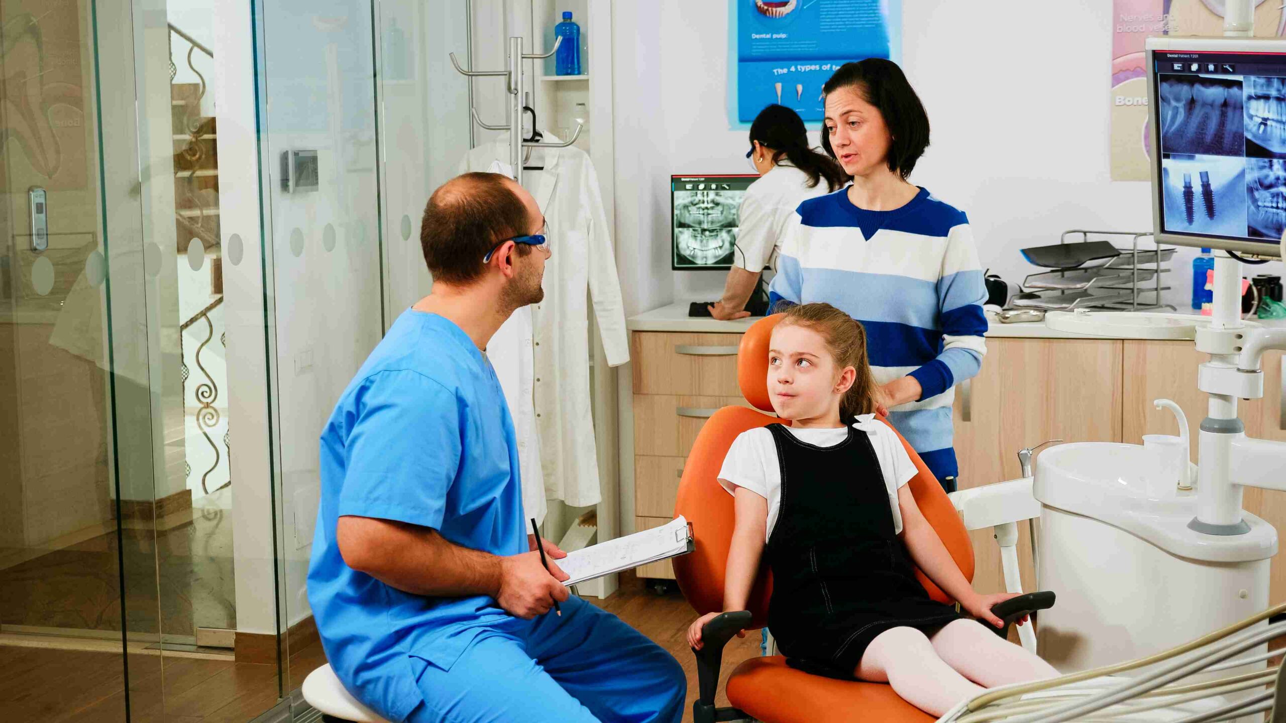 Mother and child visiting the dentist for an oral checkup