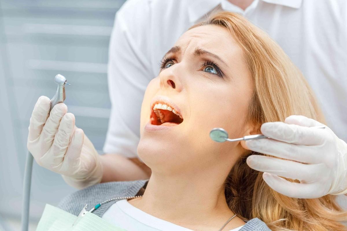 Pediatric dentist restoring a child's damaged tooth during a gentle dental visit